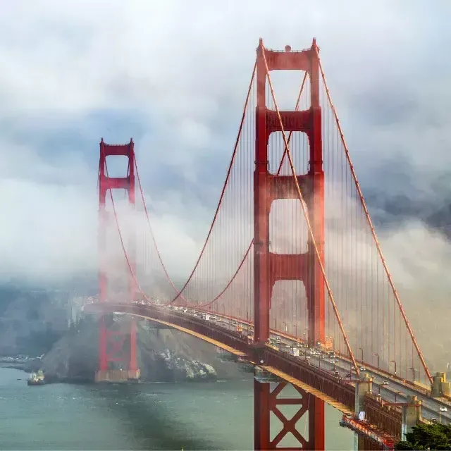 Golden Gate Bridge peaking out from behind the fog